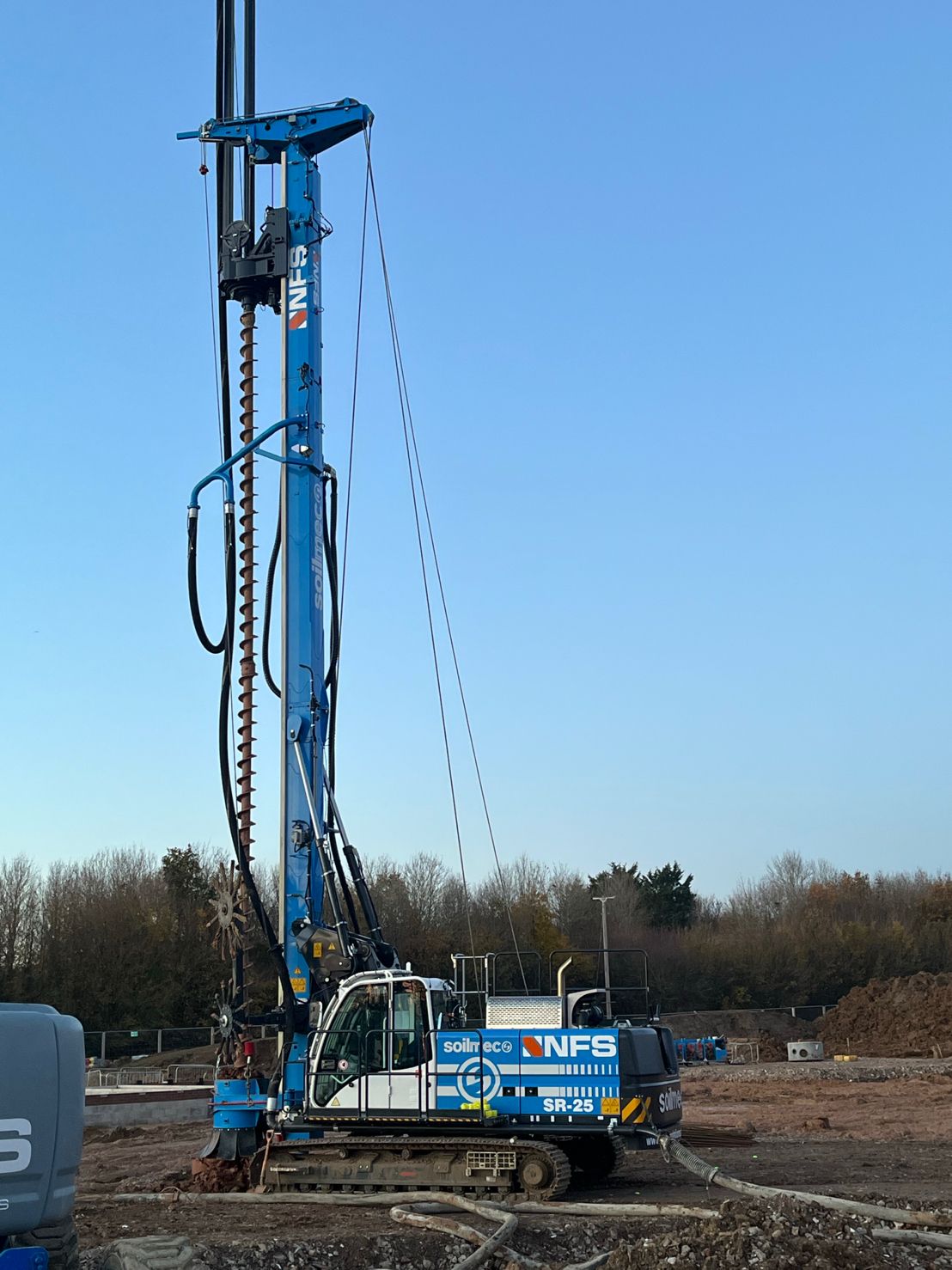 A large blue piling machine