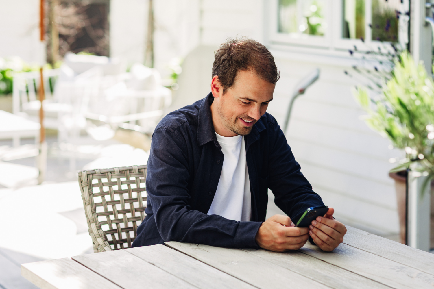 Picture of a customer looking at his phone