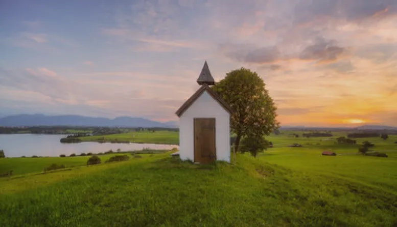 Small chapel on the banks of a river.