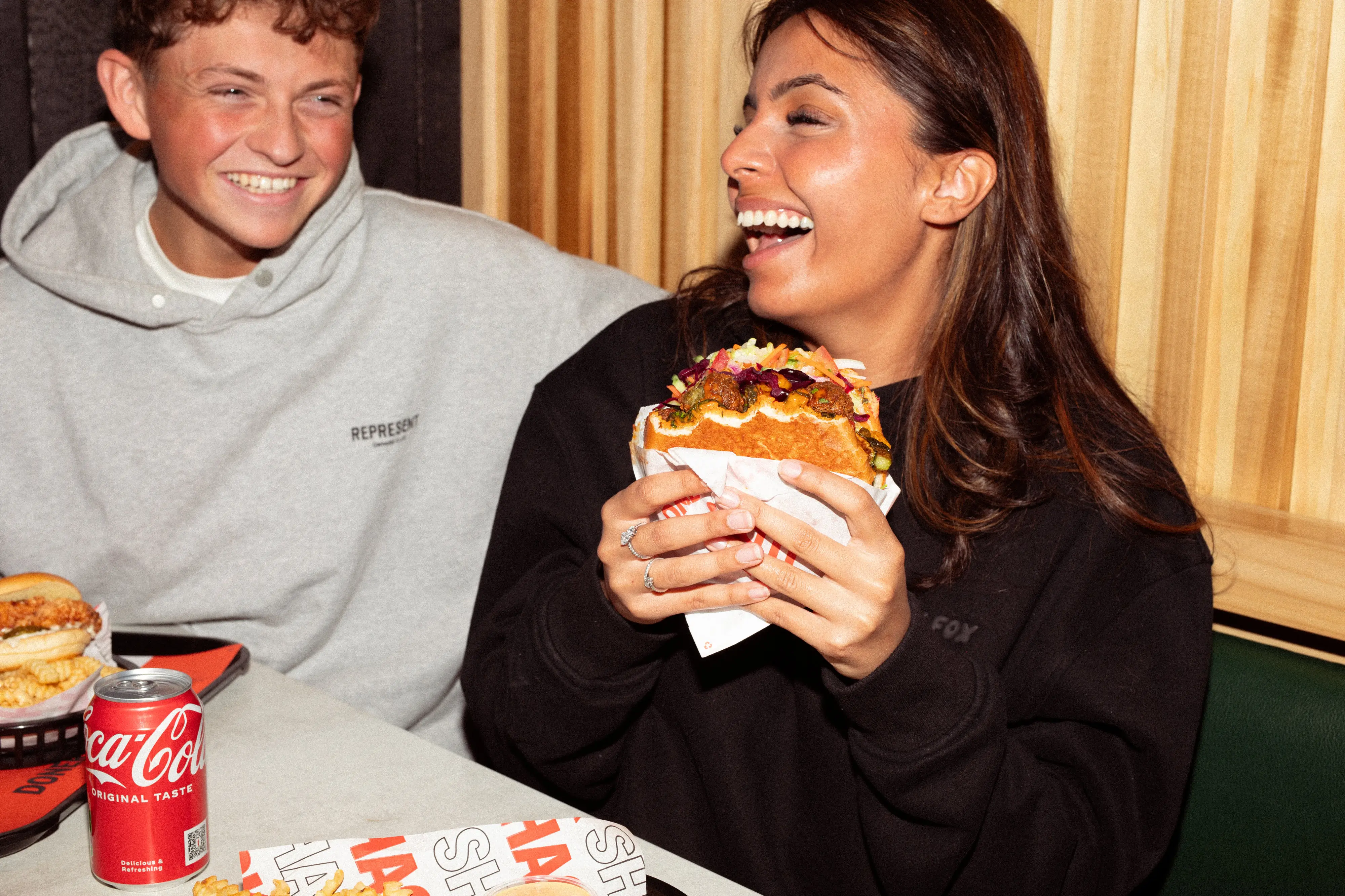 People enjoying tasty Doner Shack food and having fun