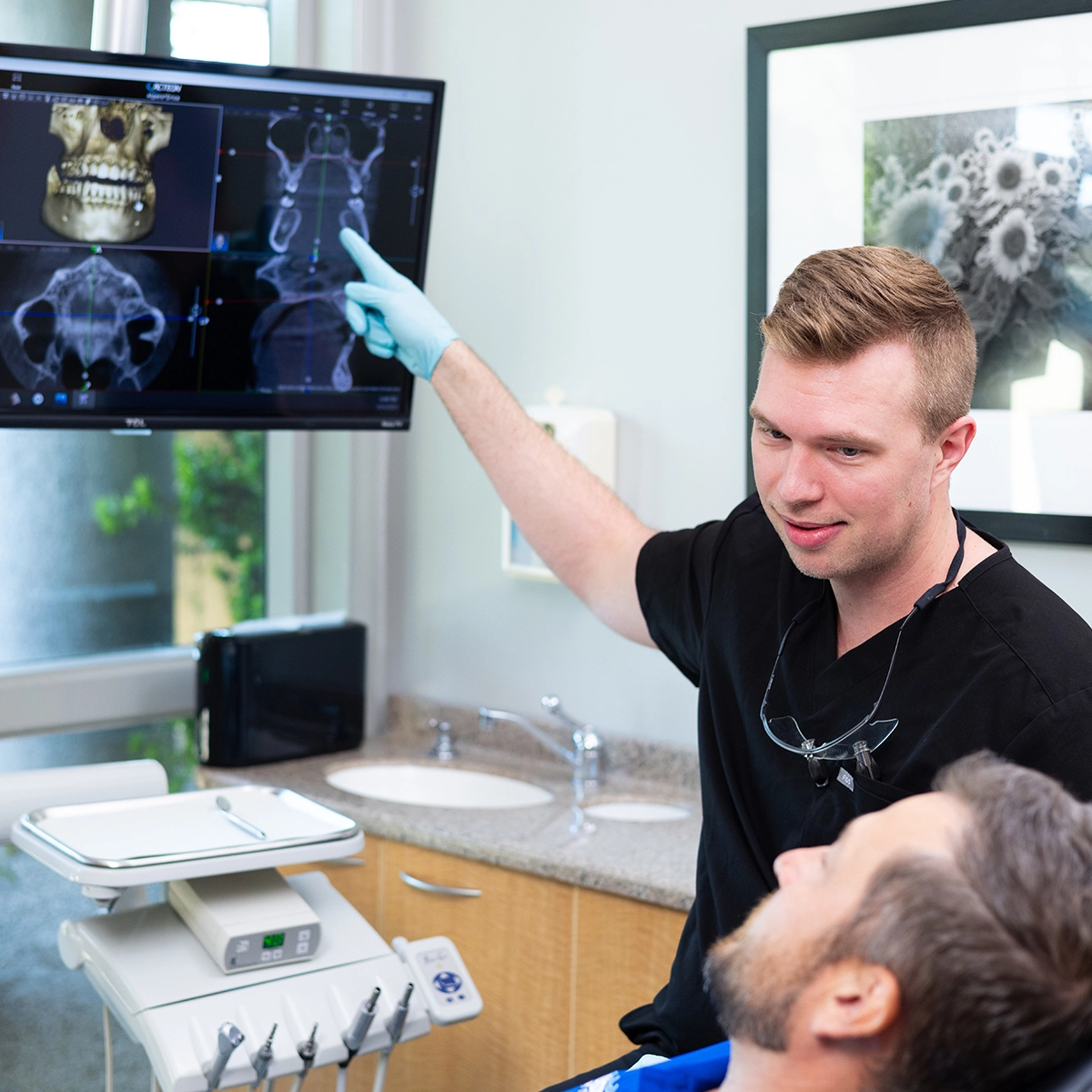Dr. Alpers reviewing 3D dental imaging with a patient at our Scottsdale dental clinic