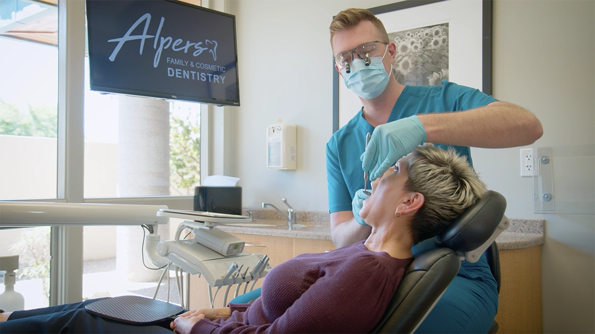 Dr. Alpers checking on a Scottsdale patient for their cosmetic dental emergency