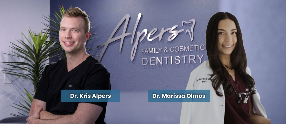 Dr. Kris Alpers and Dr. Marissa Olmos standing in front of Alpers Family and Cosmetic Dentistry office sign. Text says they offer invisalign, veneers and other cosmetic and restorative treatment options in Scottsdale, AZ.