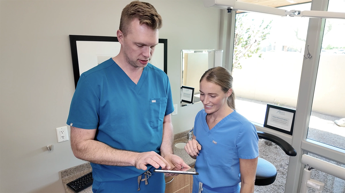 Dr. Alpers and hygienist reviewing smile case in Scottsdale dental practice.