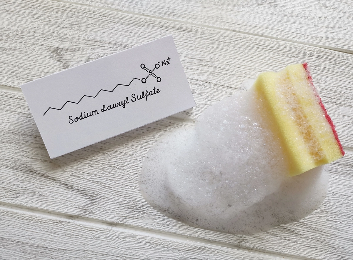 Sodium lauryl sulfate (SLS), the foaming ingredient commonly found in toothpaste that can affect the taste of orange juice after brushing.