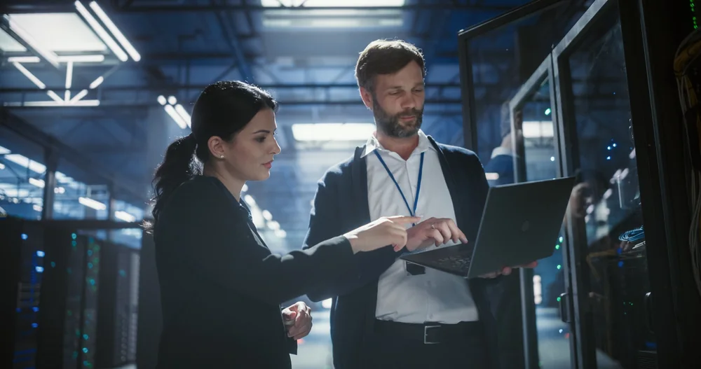 IT professionals working in a modern data centre