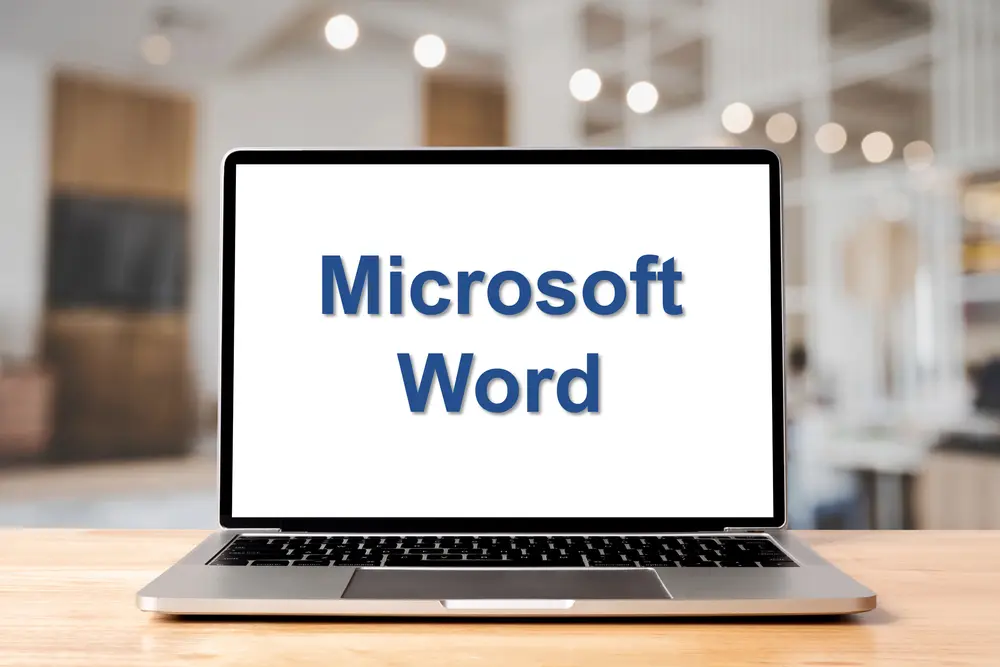 Image of laptop displaying an image containing the words Microsoft Word