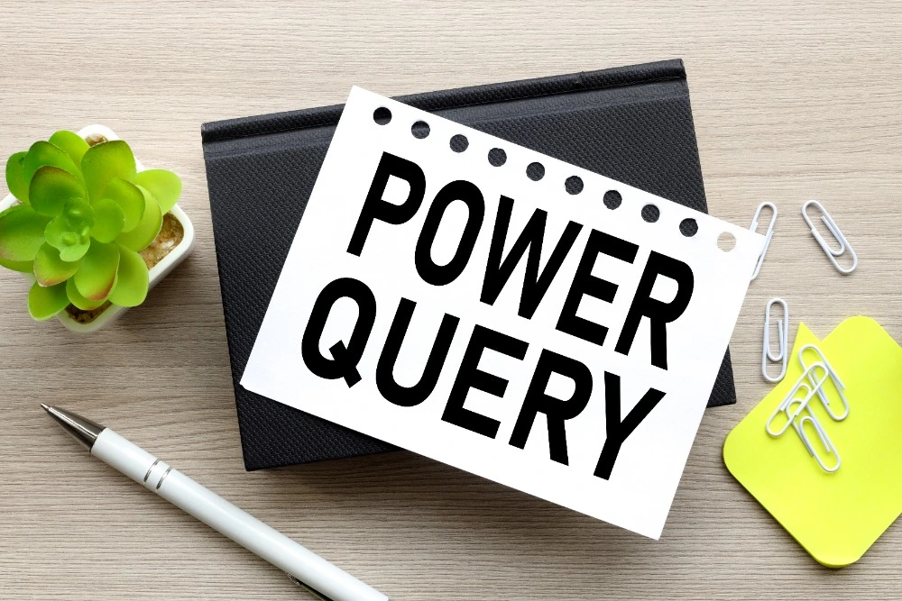 The words Power Query printed on a sheet of paper