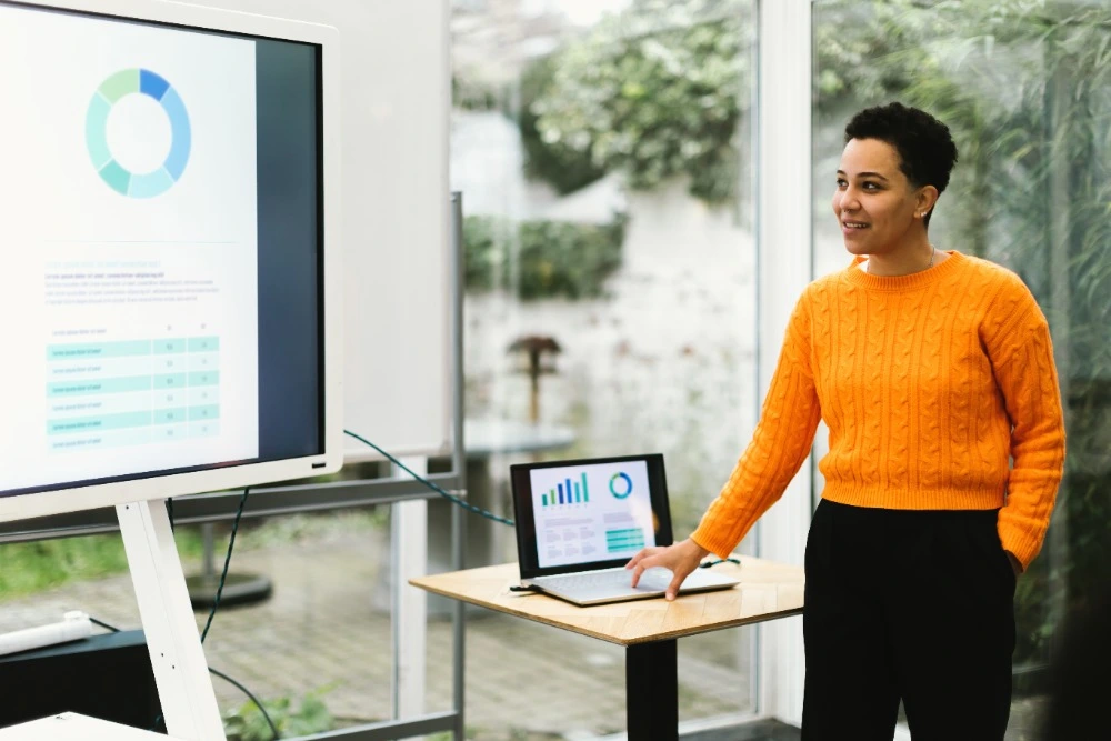 An image of someone presenting using Microsoft PowerPoint