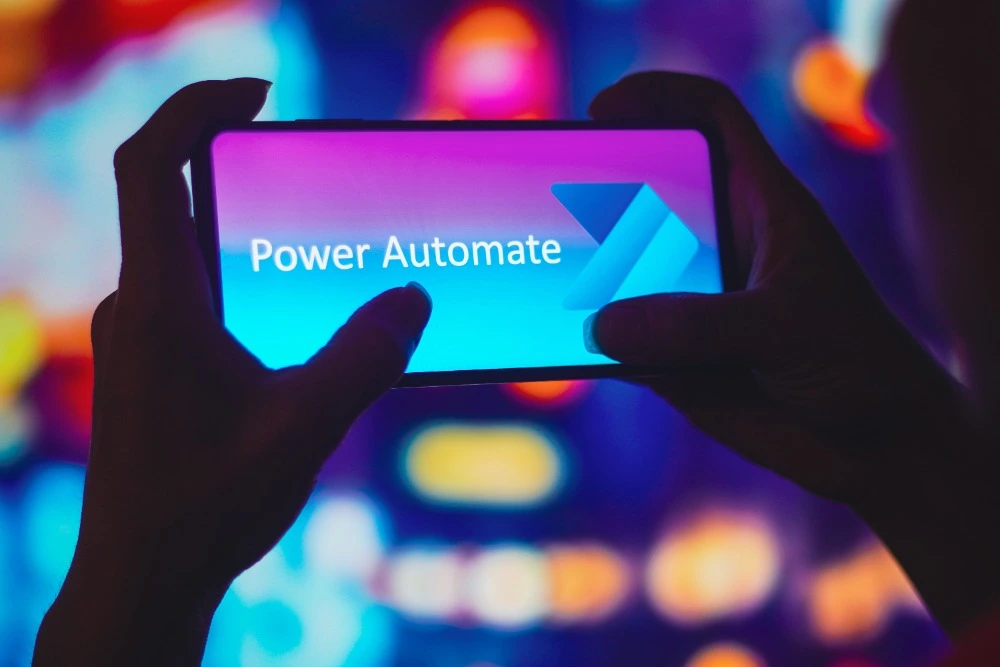 An image of a mobile phone displaying the Power Automate logo