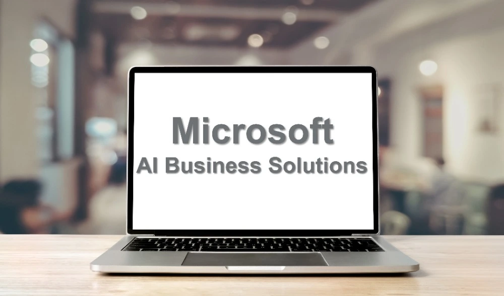 Laptop displaying the text Microsoft AI Business Solutions