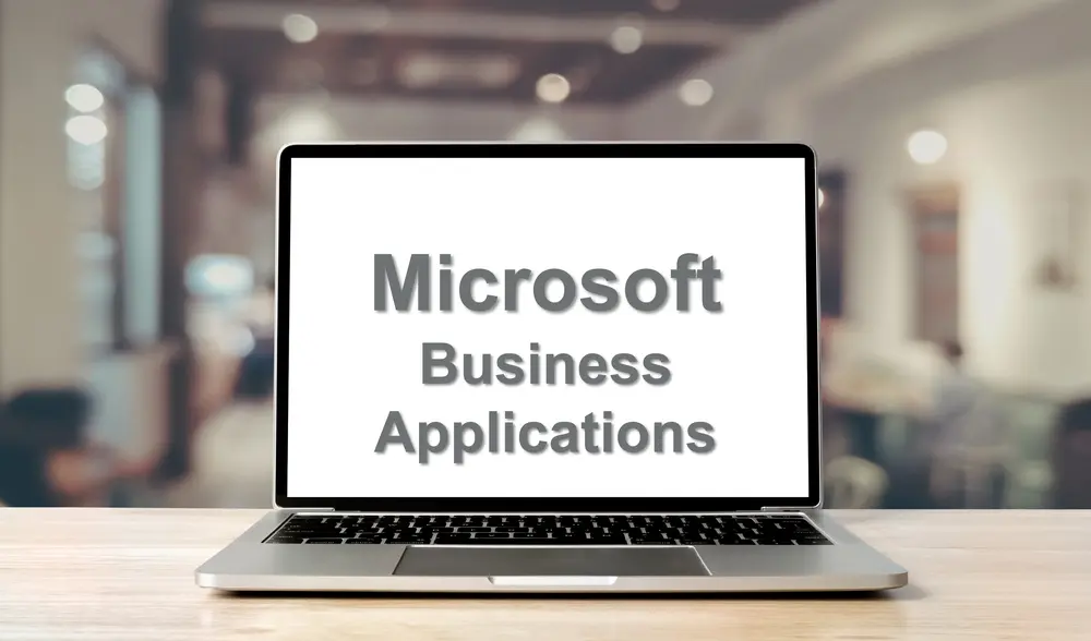 Laptop displaying the words Microsoft Business Applications