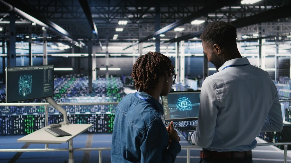 IT professionals reviewing cloud infrastructure in a data centre