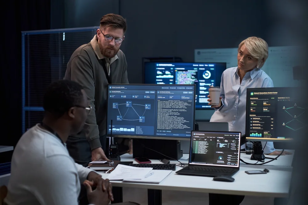 Cyber security team monitoring systems and network activity