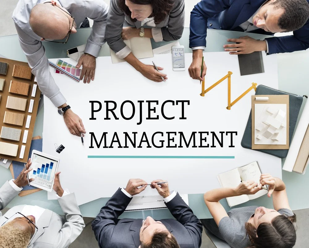 Project team reviewing project risks and planning information