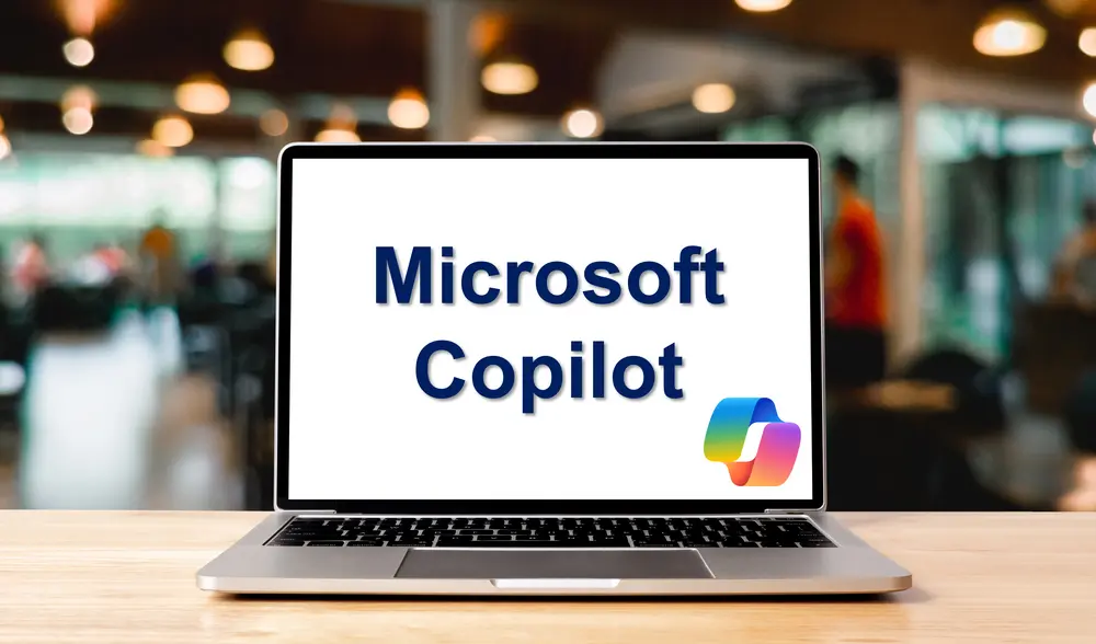 Laptop displaying text Microsoft Copilot