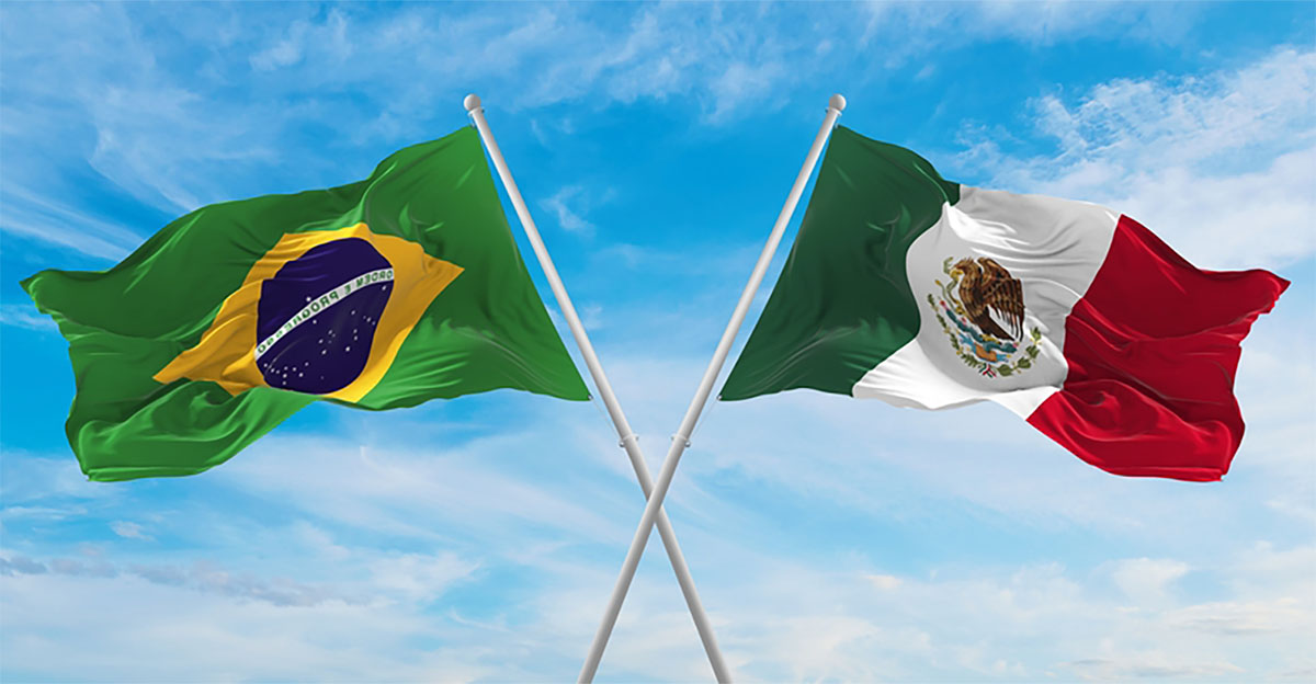 Bandeira do Brasil e do México cruzadas indicando parceria entre os dois países.