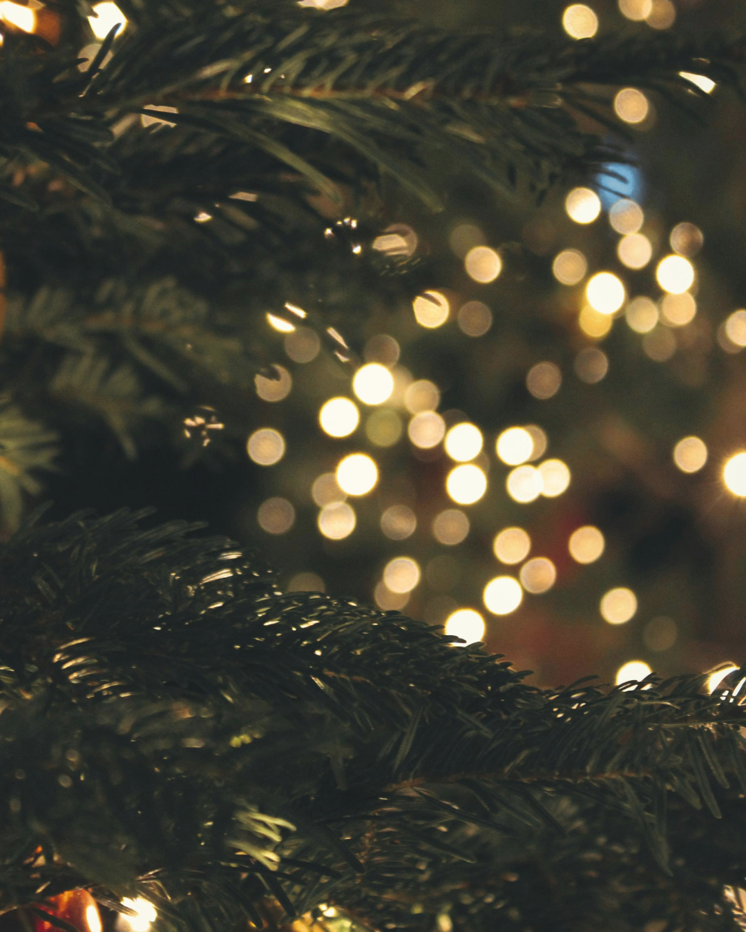 A woman and a man blurred in the background, holding keys in the foreground.