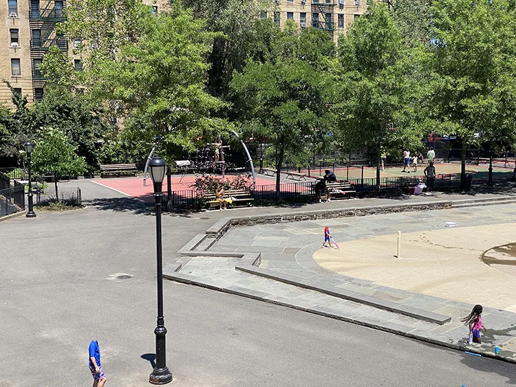 From the top of the playground's bathrooms, the new rope sphere for climbing is visible in the Inwood neighborhood playground 