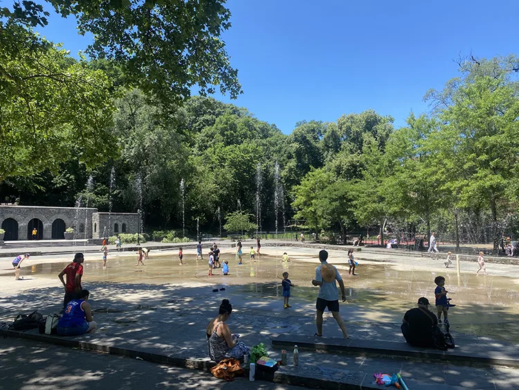 The splash pad at Anne Loftus playground was busy on a June 2026 afternoon 