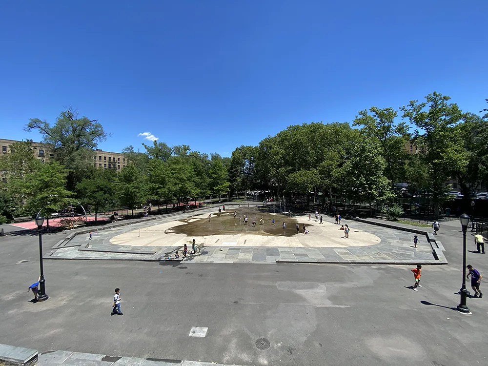 Overlooking the main splash pad at Anne Loftus Playground in Inwood from the top of the bathrooms