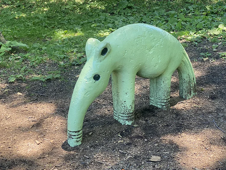 An ant eater concrete sculpture animal in the Anne Loftus playgorund