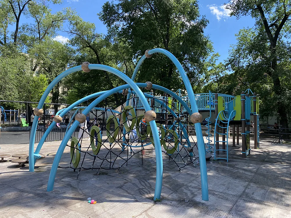 The modern rope climbing equipment is a big part of the javits playground in washington heights / hudson heights