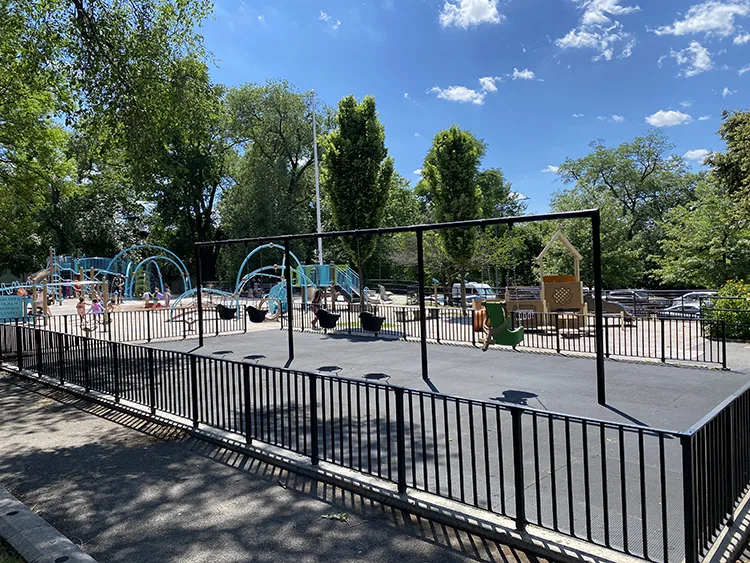 an overview of the javits playground with the swings in the foreground 