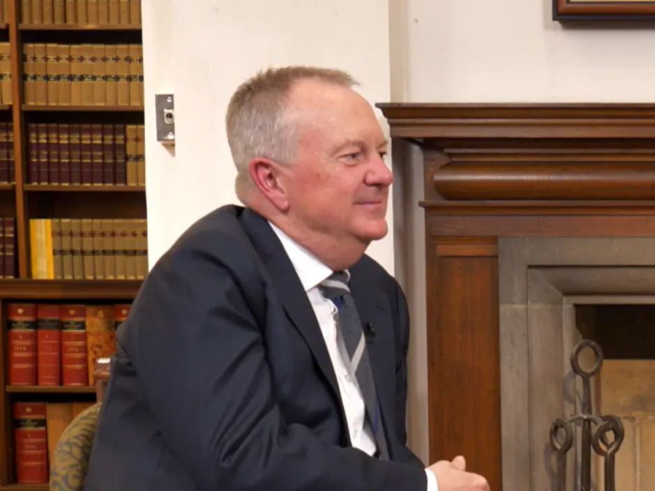  Victorian Information Commissioner Sean Morrison sitting in an office.