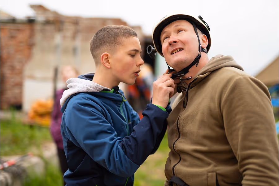 Two men setting up equipment
