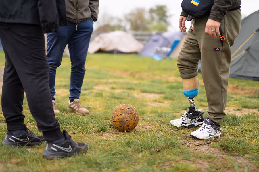 people stand near the ball