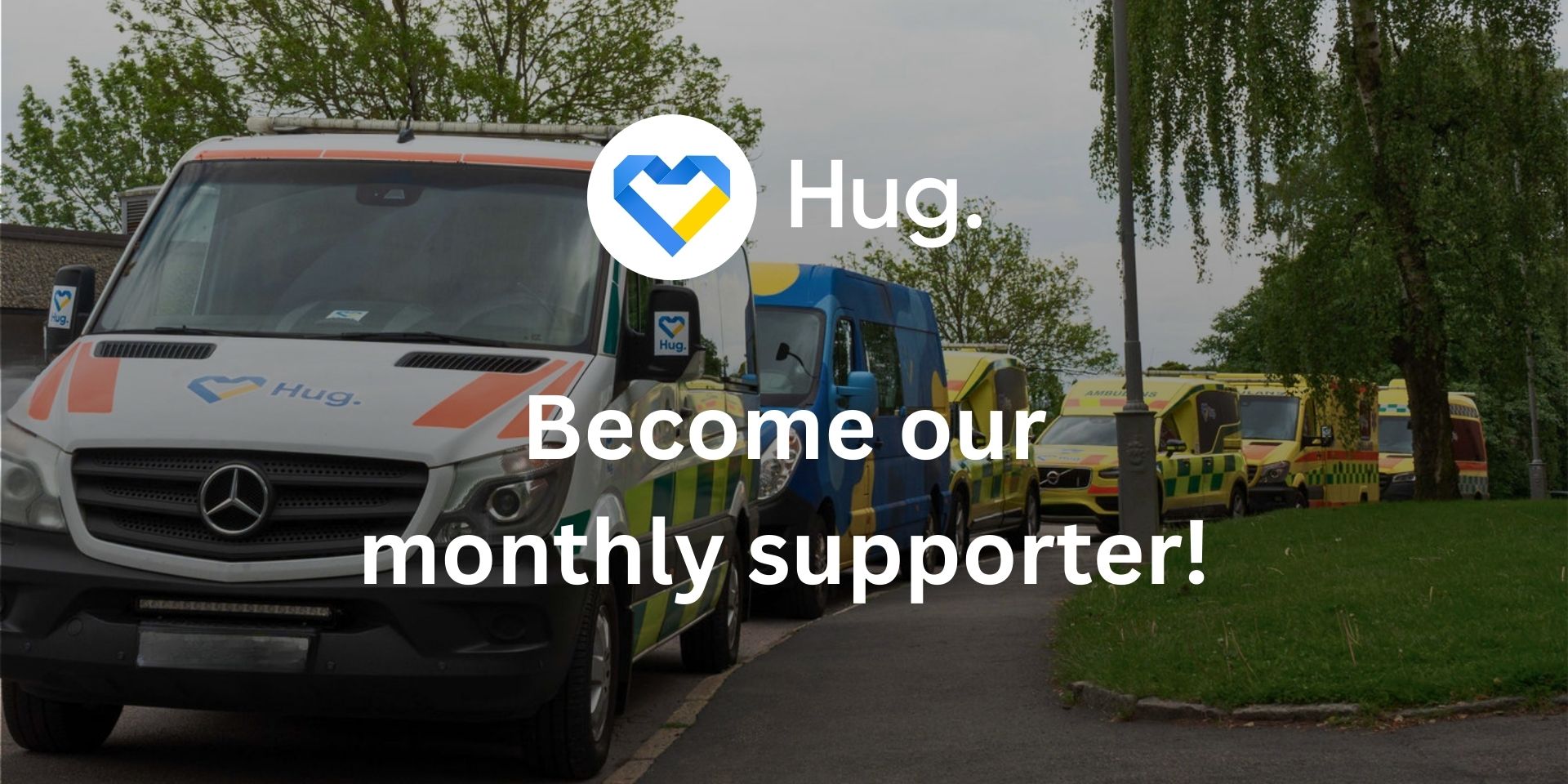 Line of ambulances parked along a road with text overlay reading 'Hug. Become our monthly supporter!'