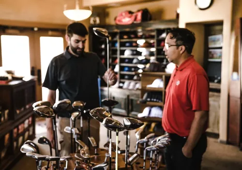 Golfers in a pro golf shop
