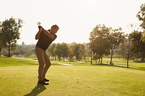 Man swinging a golf club