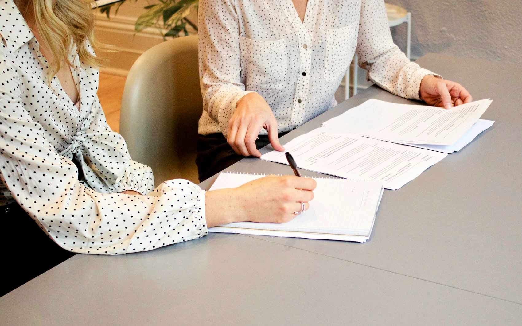 Lawyer and accountant sharing notes