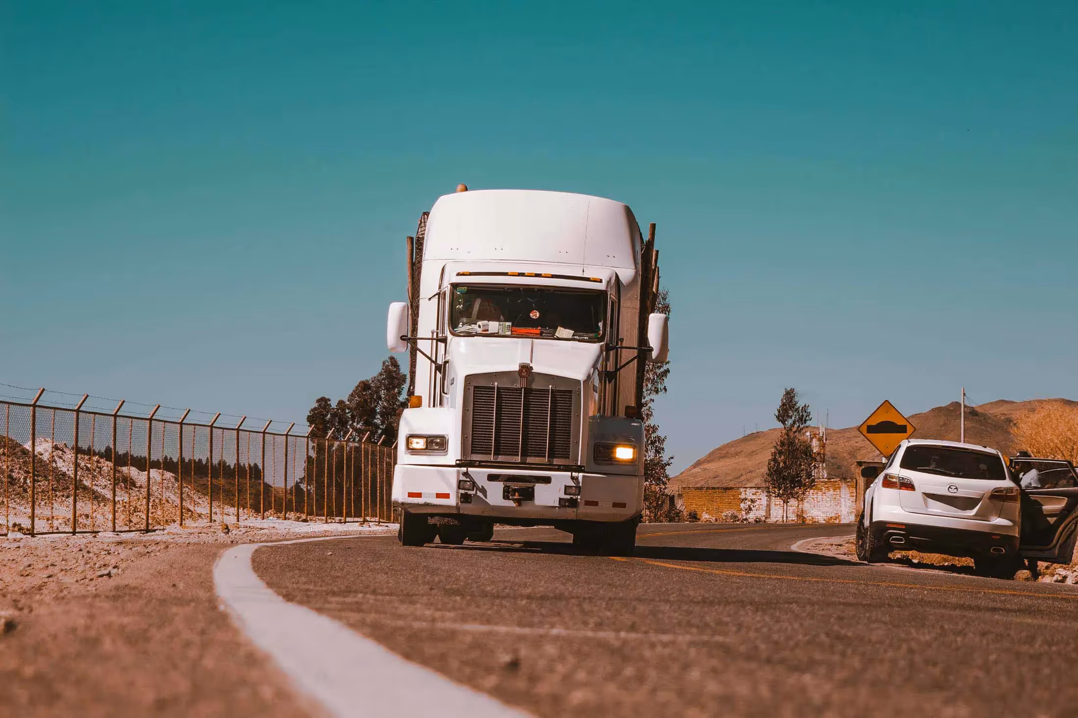 Semi truck driving down the highway