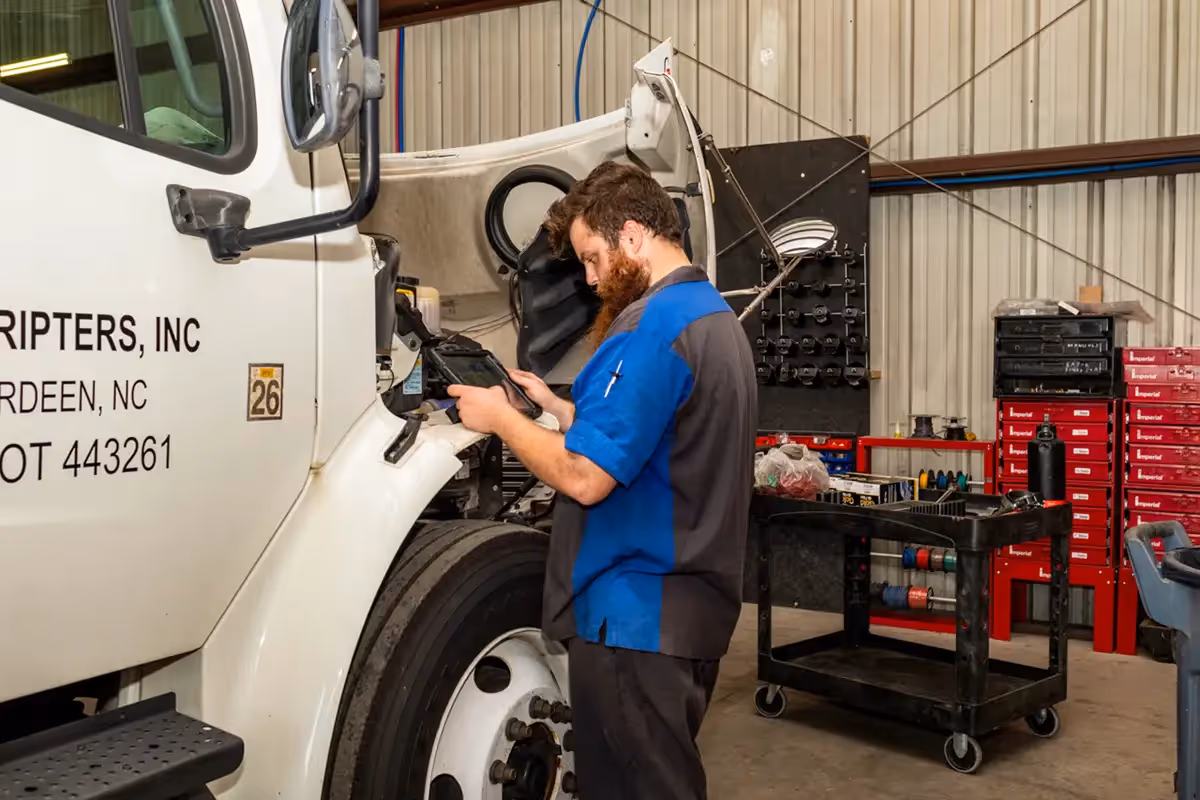 Diesel mechanic performing DOT inspection in Clearwater, Florida