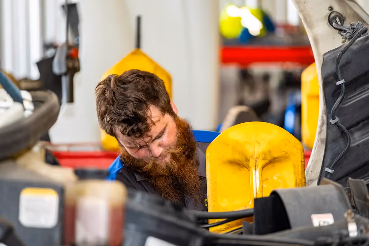 Diesel mechanic performing diesel truck repair services in Tampa, Florida