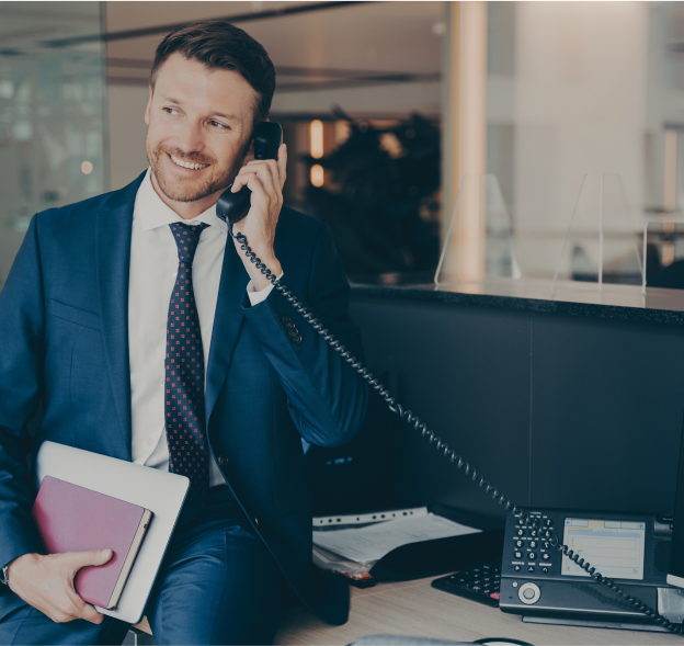 An happy man making a call.