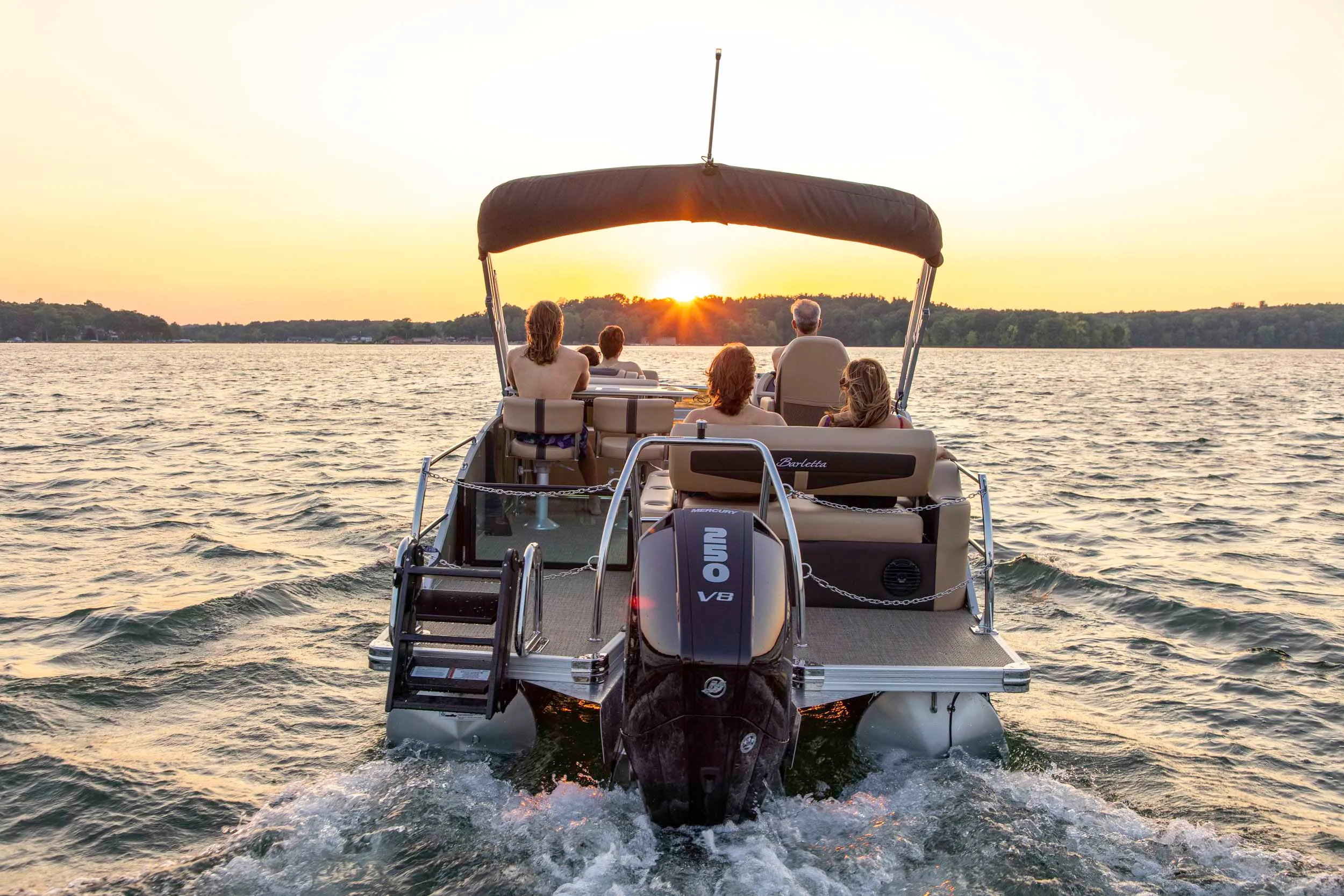 Open bow center console boat with dual engines driving in the beautiful teal salt water
