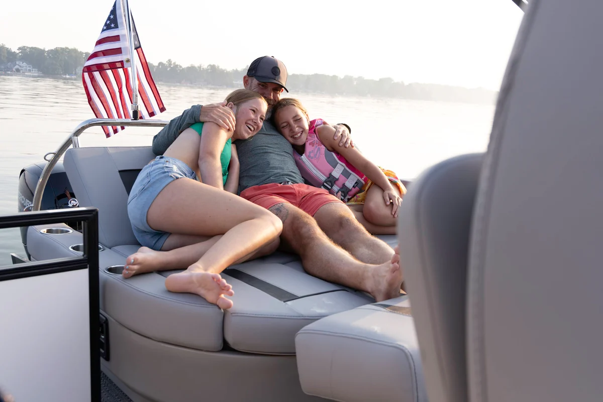 Dockhand waving hello as a boat pulls back up to the dock