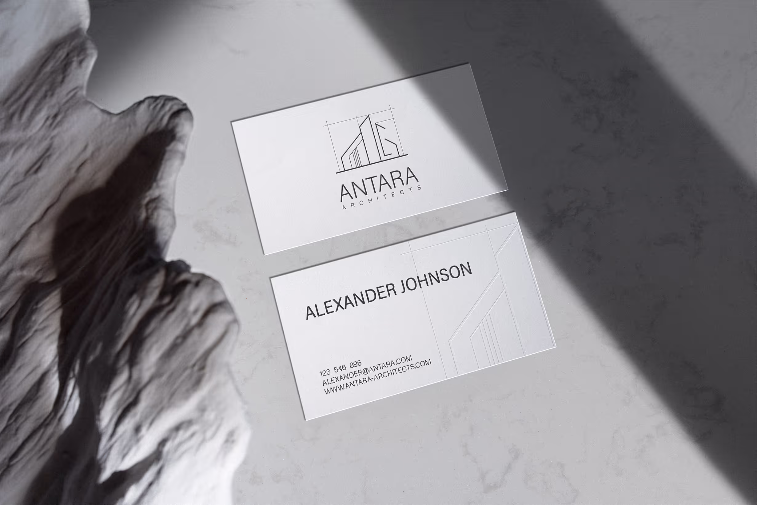 Business card mock up for Antara branding. White card with black writing. Minimalistic and modern.