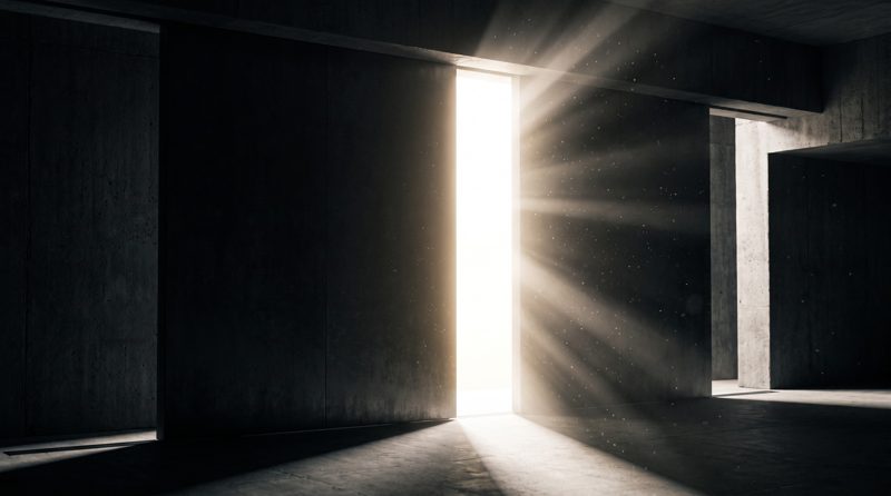 Two monolithic panels parting to reveal a wall of brilliant light, symbolising the FCA's cryptoasset authorisation gateway opening