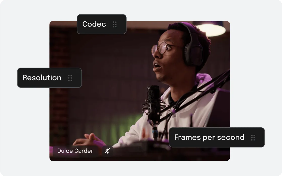 Man wearing glasses and headphones speaking into a microphone in a dimly lit room with labels for Codec, Resolution, and Frames per second.