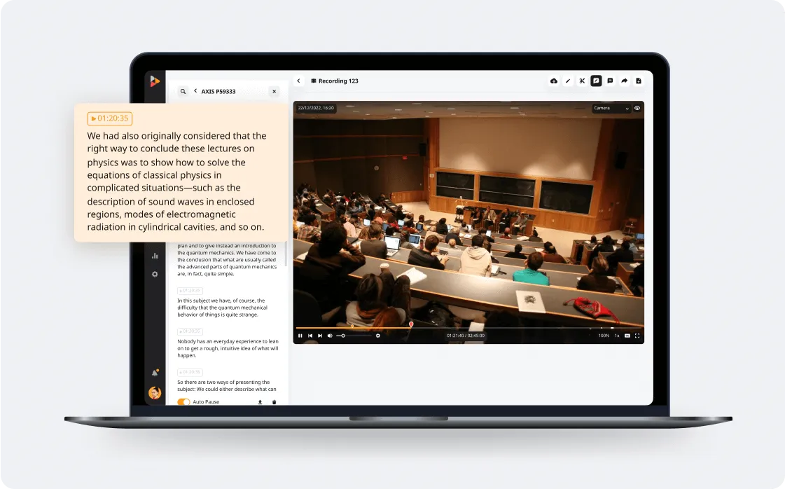 Laptop screen showing a lecture recording with a classroom of students and synchronized text transcript with highlighted physics lecture notes.