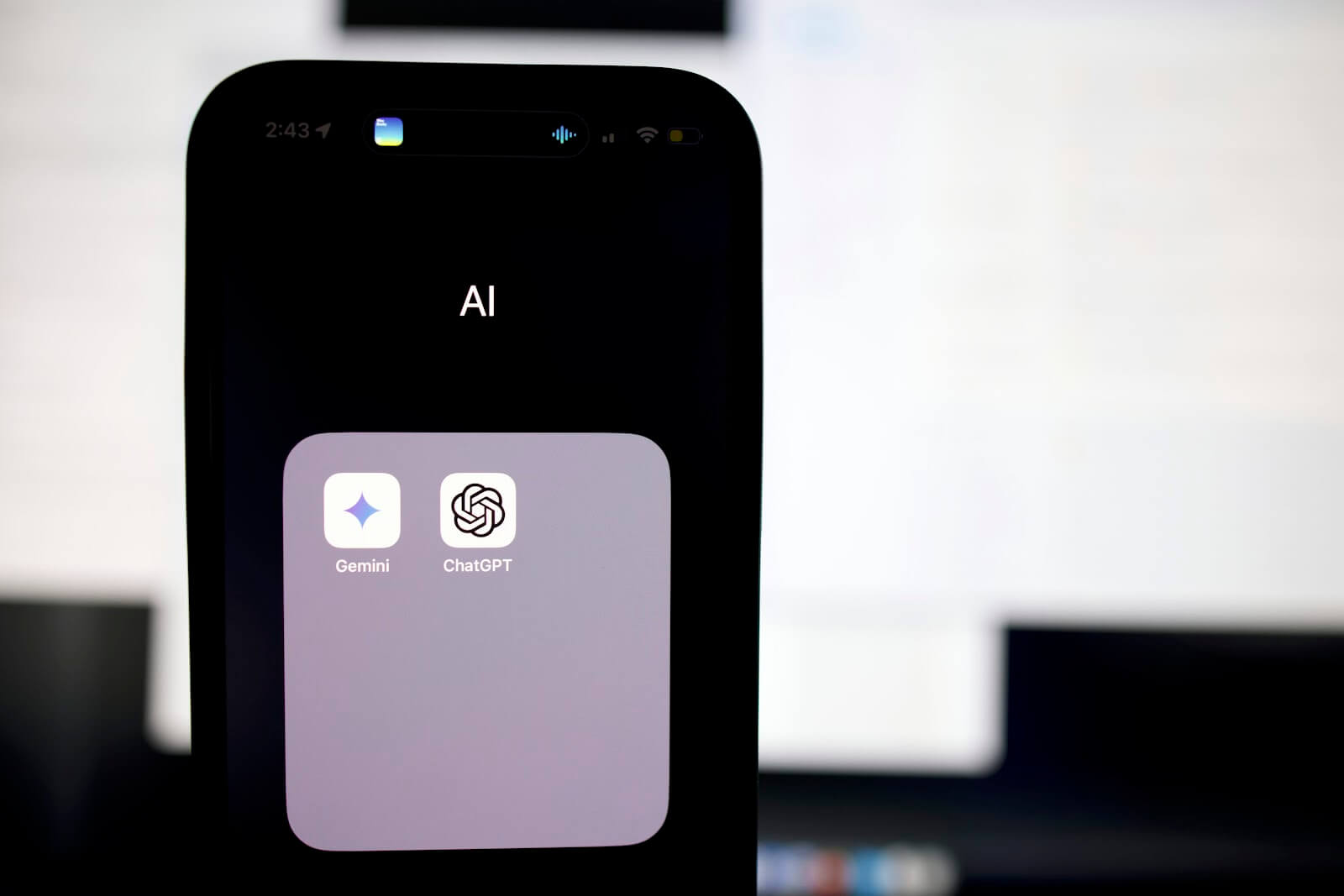 AI chatbots Gemini and ChatGPT displayed on a smartphone screen