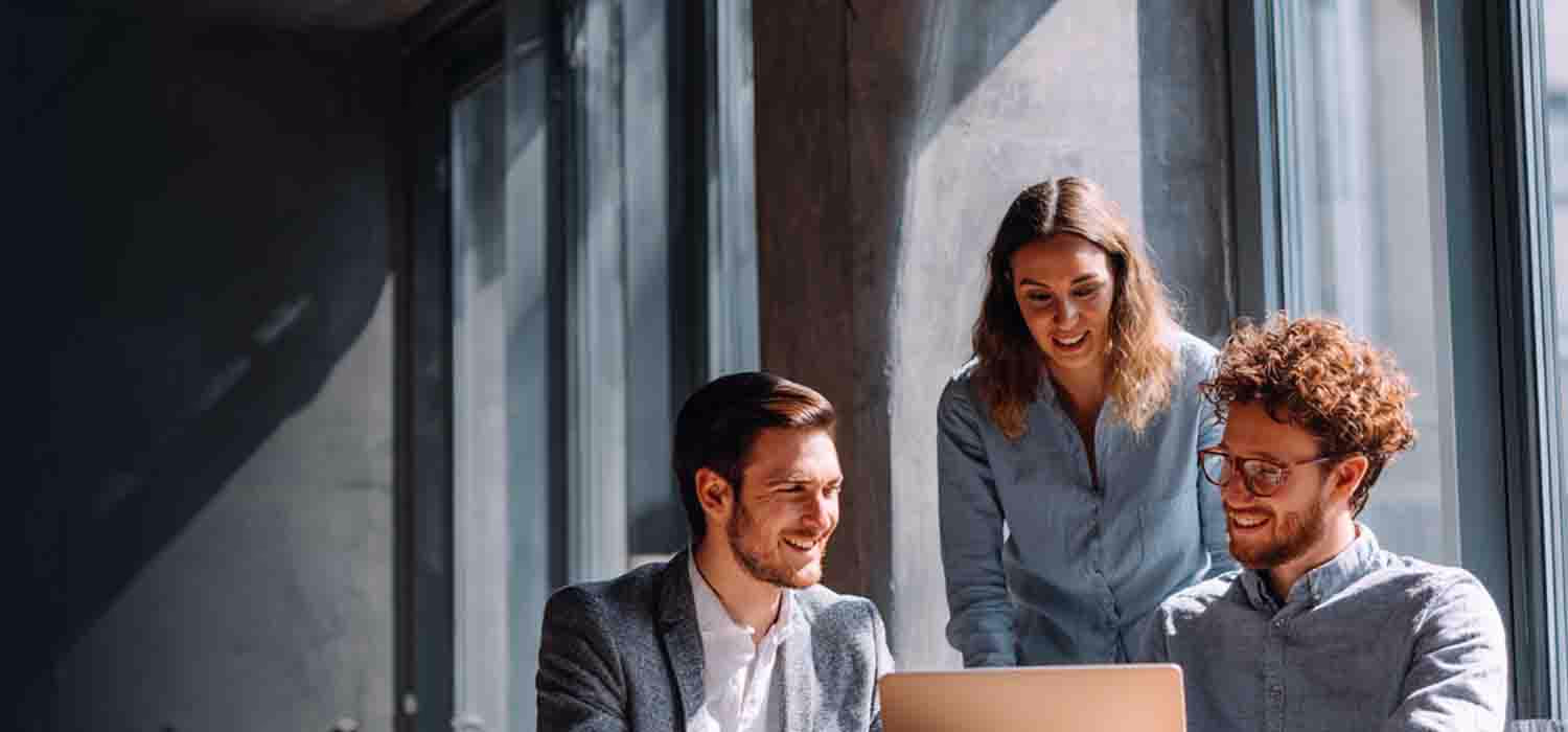 Team collaborating on IT business support services