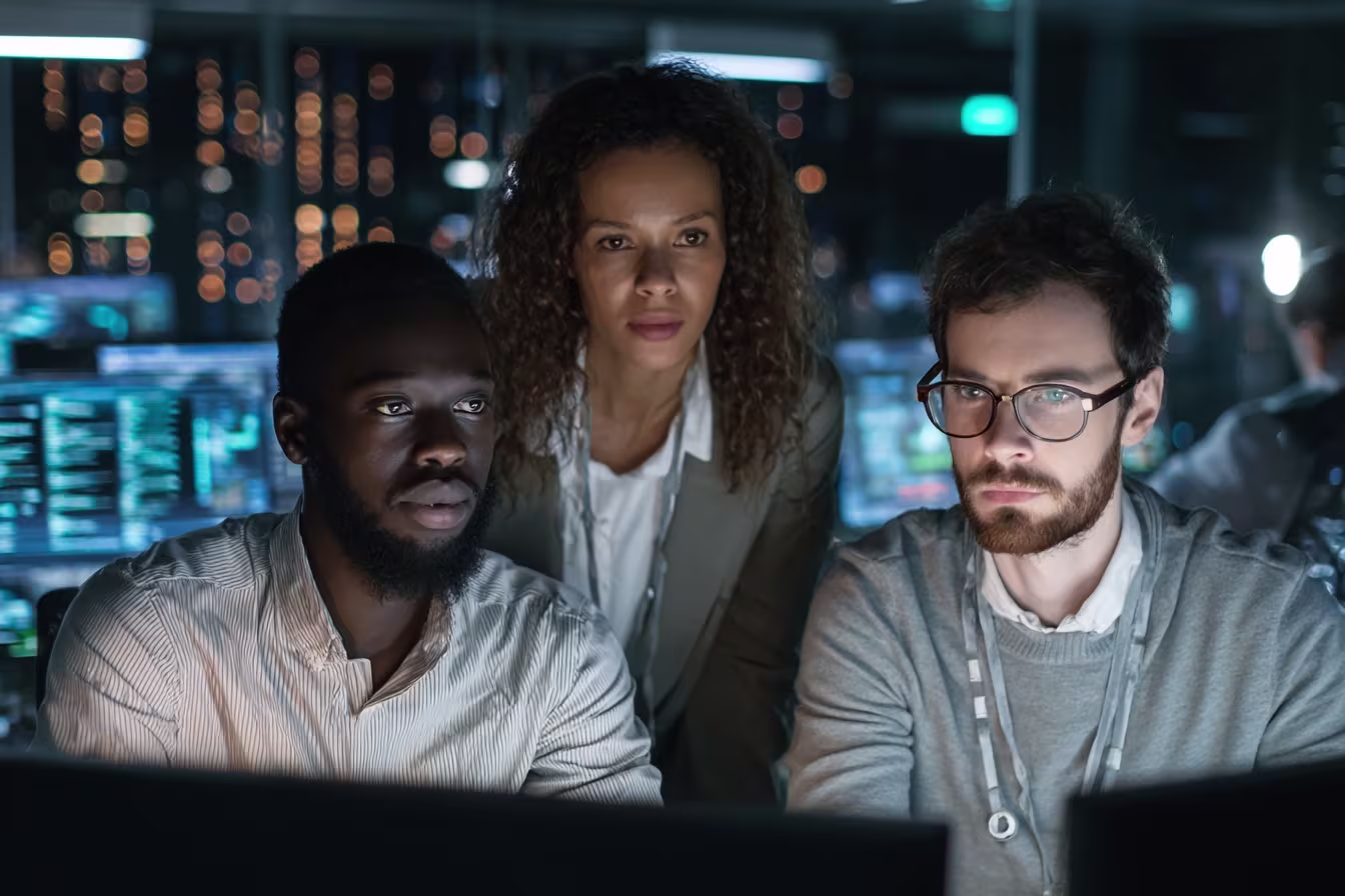 Diverse IT professionals monitoring SIEM data