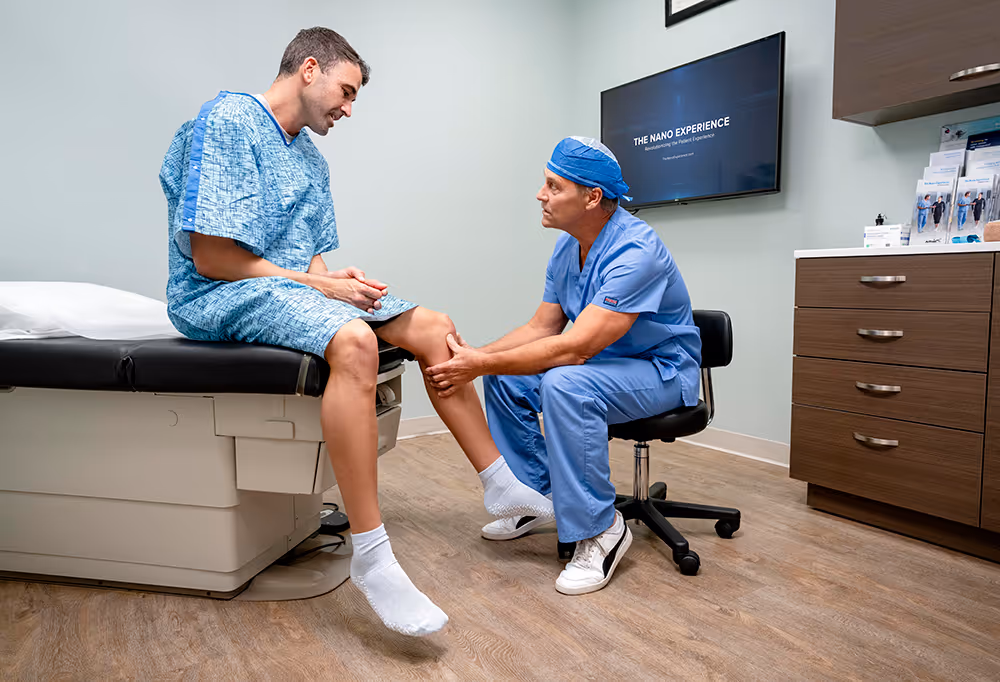 Orthopedic surgeon and assistants performing surgery