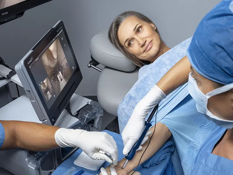 Surgical operating room with orthopedic specialist observing student